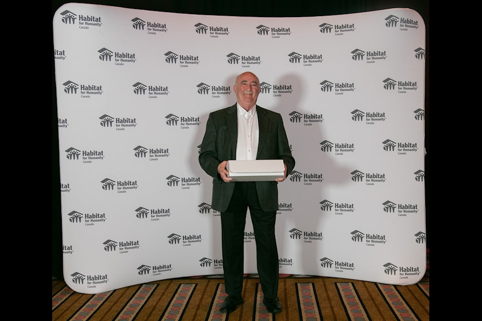 Dave Hurley receives his award at the Habitat for Humanity gala earlier this month.
