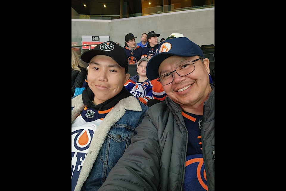Connor Sanguez, left, and his father Boris Sanguez sit at an Edmonton Oilers game just before the team made the 2024 Stanley Cup playoffs. The team is now battling the Florida panthers for the Stanley Cup, and could become the first Canadian team to win the trophy since 1993. Photo courtesy of Boris Sanguez