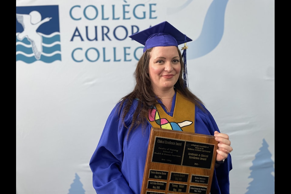 Danielle Heslin shows off her clinical excellence award she received during the Aurora College North Slave Campus' graduation ceremony at the Chateau Nova on May 31.