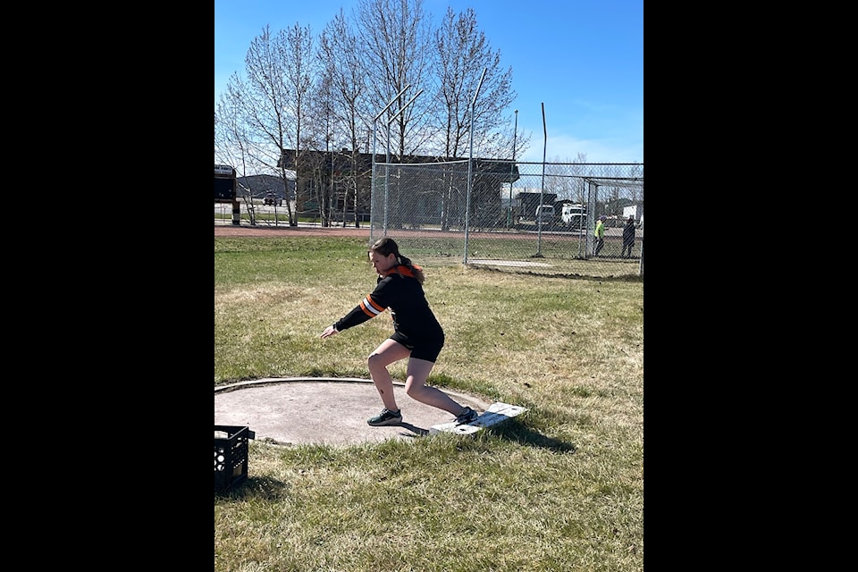 Eleanor Bassett practices shot put during a track and field prep session at Diamond Jenness Field last month. 