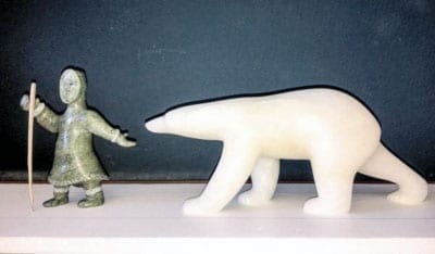 A large-scale replica of Cape Dorset artist Koomuatuk "Kuzy" Curley's carving of an elder leading a polar bear has been selected for placement at the entrance of the Canadian High Arctic Research Centre opening in Cambridge Bay this summer. - photo courtesy of Isabelle Laurier