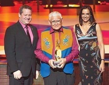 Fort McPherson’s Charlie Snowshoe was presented with an Indspire Award for his environmental work during a ceremony in Winnipeg on March 21. From left, Glen Abernethy, minister of health and social services, Charlie Snowshoe and Arielle Meloul-Wechsler, vice president of human resources for Air Canada. - photo courtesy of Indspire 