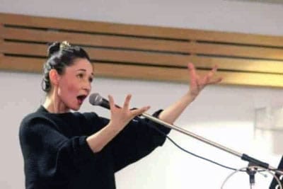 Reneltta Arluk, founder of Akpik Theatre, tells a story during the Open Sky Creative Society coffee house on March 7, 2015. Shane Magee/NNSL photo