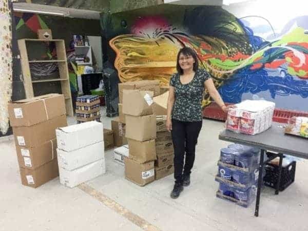 Akiitiq Angutiqjuaq stands in the food bank in Iglulik, where sh