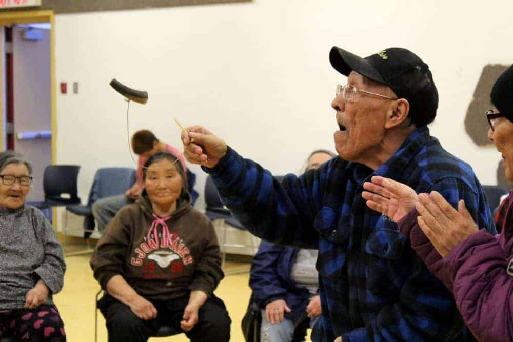 Donald Kogvik engages in a game of skill known as ayaagaq.