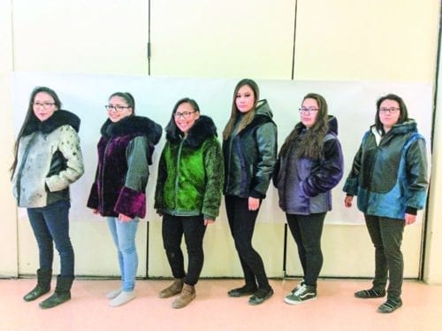 Among the female Grade 12 graduates who made their own sealskin jackets in a special program at Sakku School are, from left, Kayleen Emiktowt, Shantea Bruce, Christa Emiktowt, Krissy Harron, Devonna Ell and Shania Eetuk in Coral Harbour on Sept. 10, 2018. Missing from photo is Linda Ningeongan. Photo courtesy Rhoda Paliak-Angootealuk