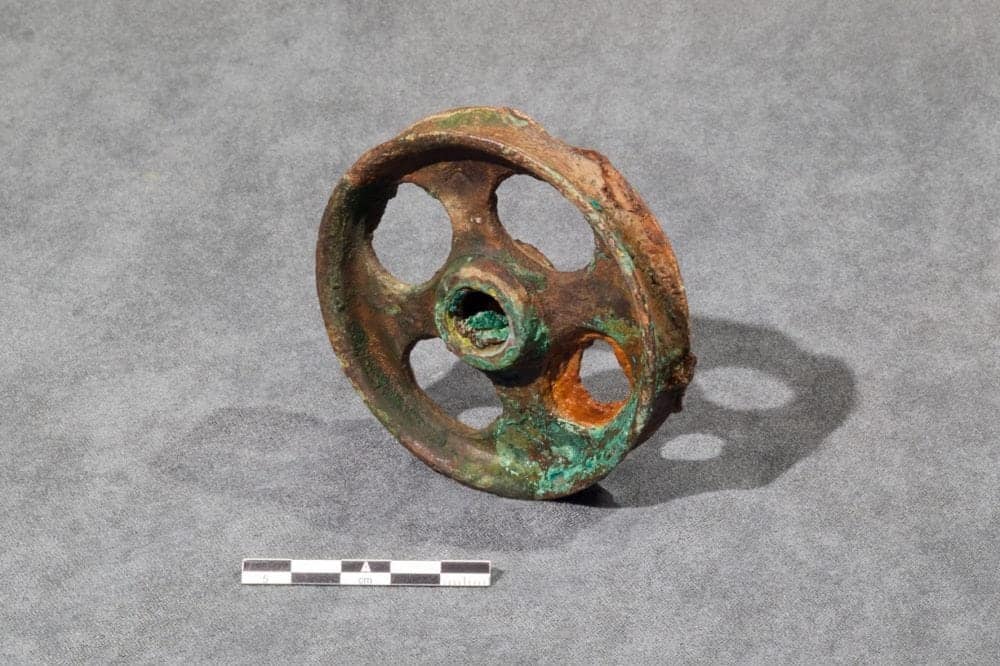 One of three pulley wheels found together on the fore, starboard side of the upper deck of the HMS Erebus. These were used in some of the numerous wooden and metal pulley blocks used in running rigging. At least one of them is marked with a broad arrow. photo courtesy of Parks Canada