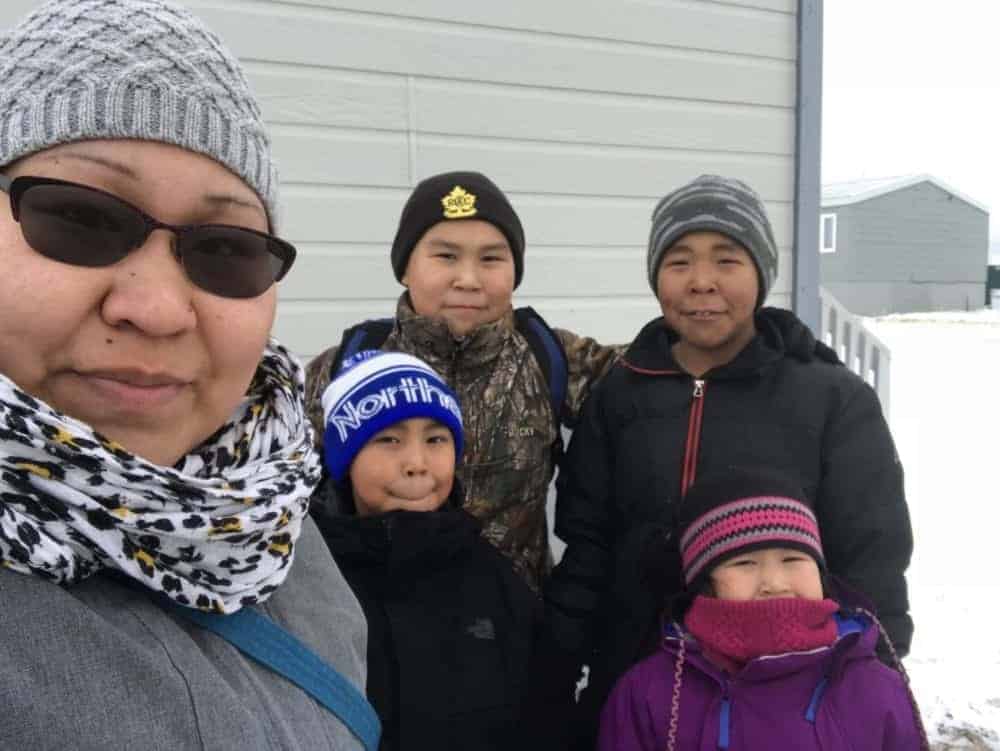 Cambridge Bay's Suzanne Maniyogina and her four children don't have a vehicle. They were expecting their truck, ordered from Hay River, NWT, to arrive by sealift. Now it's not clear whether it will be shipped by air as the last barge to Cambridge Bay was cancelled. Her children are Tayten and Jeremiah, back, and Graysen and Azalea, front. photo courtesy of Suzanne Maniyogina