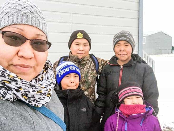 Cambridge Bay's Suzanne Maniyogina and her four children don't have a vehicle. They were expecting their truck, ordered from Hay River, NWT, to arrive by sealift. Now it's not clear whether it will be shipped by air as the last barge to Cambridge Bay was cancelled. Her children are Tayten and Jeremiah, back, and Graysen and Azalea, front. Photo courtesy of Suzanne Maniyogina.