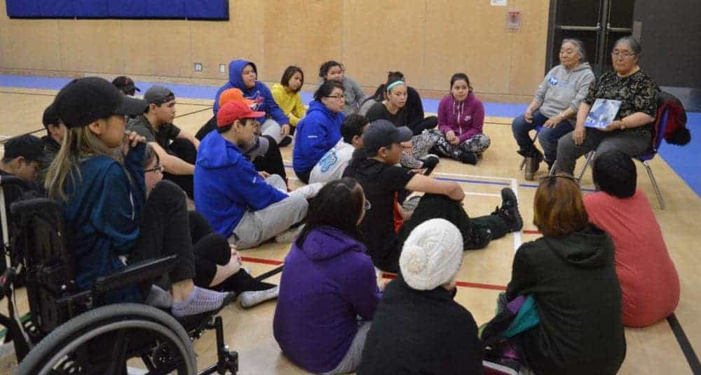 Elders Salomie Qitsualik and Martha Atkitchok speak to students at Qiqirtaq Ilihakvik in Gjoa Haven. The elders have requested that they meet with students on a monthly basis. 
