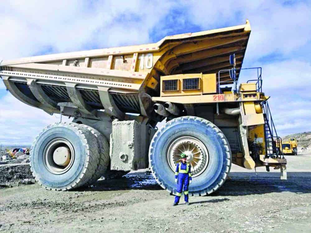 Britney Nadli, despite posing with a haul truck, works in the process plant at the Diavik diamond mine. "The job that I'm doing now in the process plant was way beyond my expectations of where I thought to see myself," she says. photo courtesy of Diavik Diamond Mines