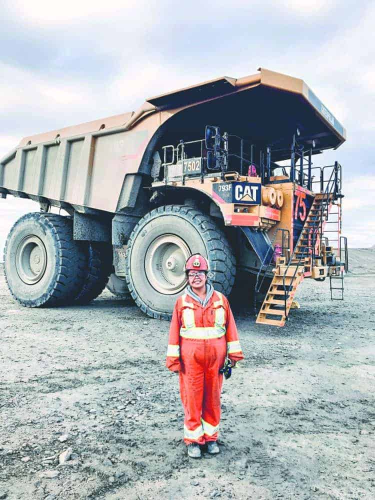 Shelby Nadli of Fort Providence at the Diavik mine site with a haul truck, which she operates. Photo courtesy of Dominion Diamond Corporation