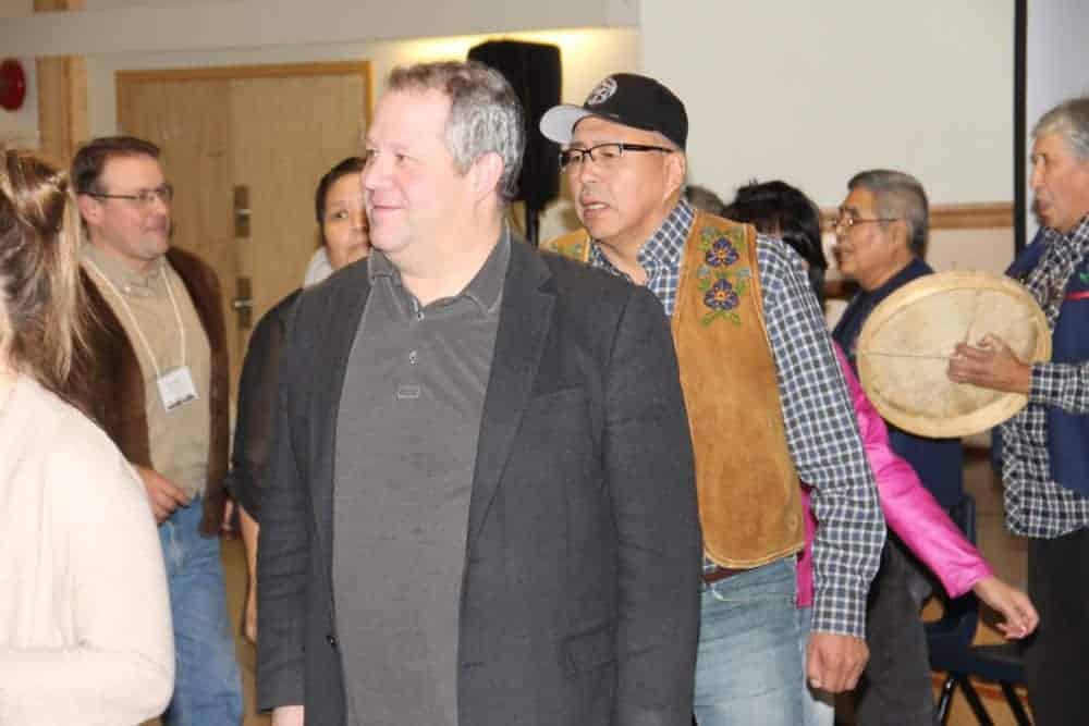 Health and Social Services Minister Glen Abernethy, front, along with Deh Cho MLA Michael Nadli, join a drum dance Nov. 7 on the Hay River Reserve at the close of a two-day Anti-Poverty Roundtable. Paul Bickford/NNSL photo