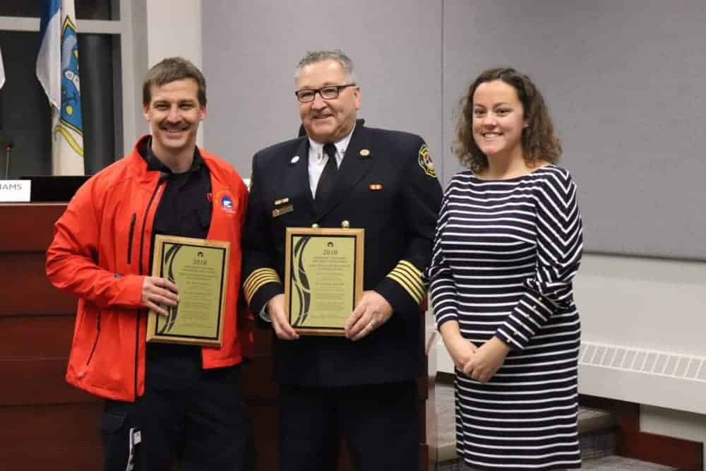 Christian Bitrolff, left and John Fredericks receive their 2018 Fire Service Merit Awards from Rebecca Alty, Mayor of Yellowknife. Dylan Short/NNSL photo
