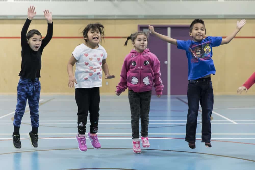 It's all excitement for this group of students from Deh Gah School in Fort Providence as they take part in an exercise run by the Pacific Institute for Sport Excellence from Vancouver earlier this month. They are, from left, Phoenix Krutko, Gitta Causa, Hailey Bonnetrouge and Calin Landry. photo courtesy of Thorsten Gohl