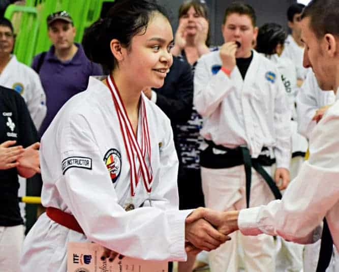 Jennifer Ellsworth is seen at an event earlier this year receiving an award. Ellsworth is one of the newest black belts at the Iqaluit Taekwondo Society. 窪蹋勛圖厙 file photo