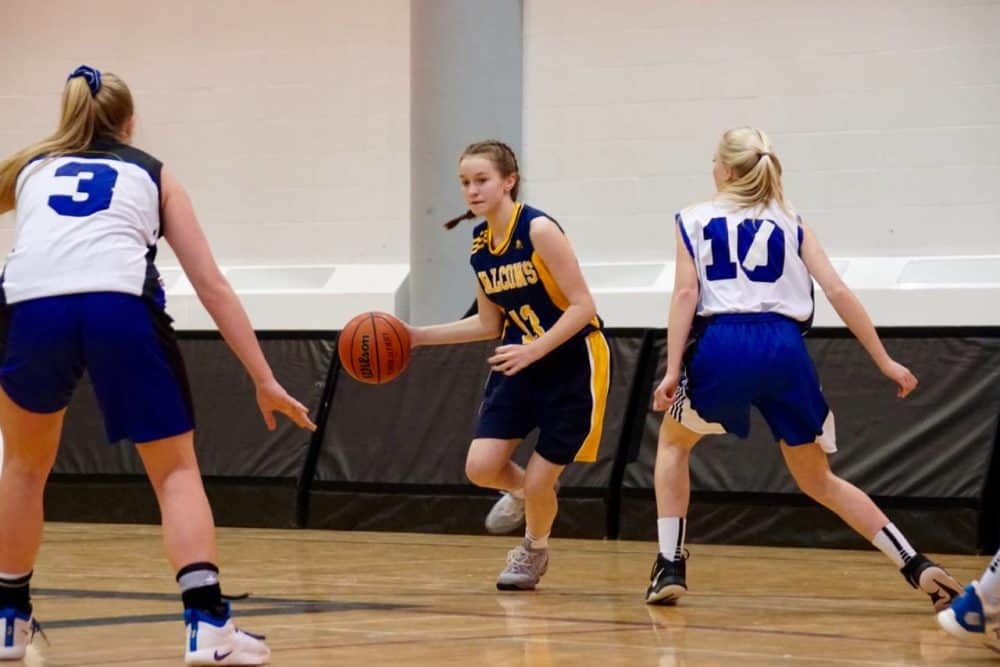 Taya Straker moves the ball up the court during Wolves classic action last week. photo courtesy of Benji Straker photography