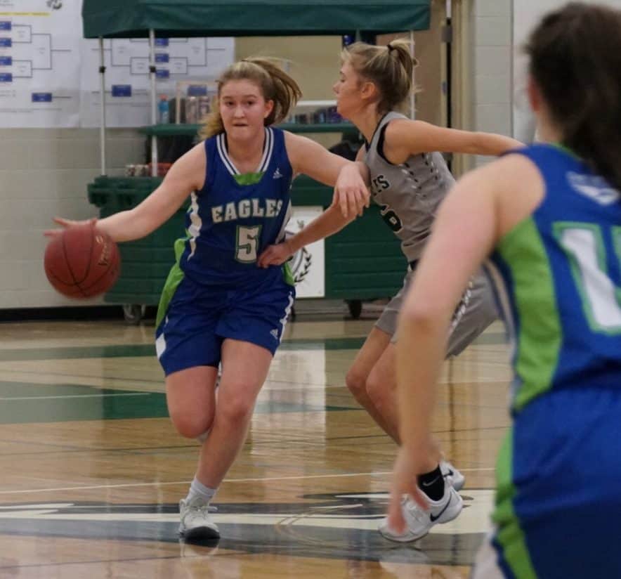 Mali Straker looks to get by a defender from Calgary's Centennial High School during action in the Centennial Howler Tournament in Calgary on Feb. 8. photo courtesy of Benji Straker