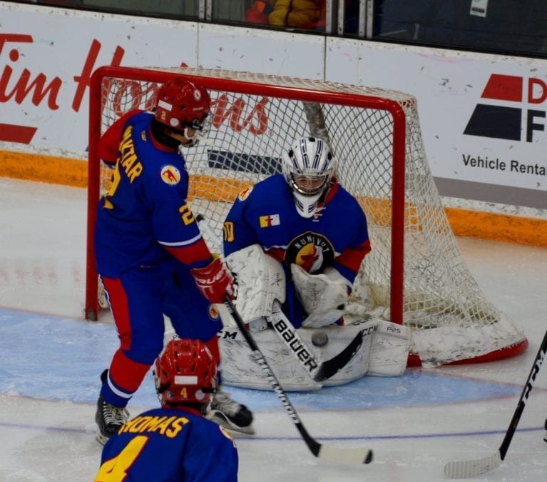 Inuuki Burke of Iqaluit makes the pad save during action against Team NT at the Canada Winter Games in Red Deer, Alta., on Feb. 18. Carly Morison/Canada Winter Games photo