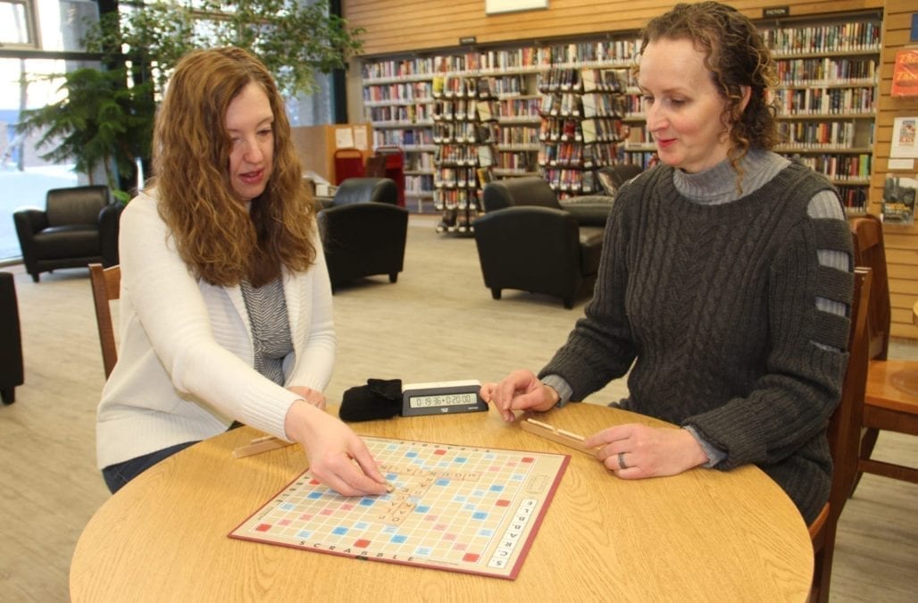 Kandace Groenewegen, left, and Tatiana Petrov, the program librarian at NWT Centennial Library, demonstrate how to play Scrabble. The library will be hosting the Deep Winter Scrabble Tournament on Feb. 23. Paul Bickford/NNSL photo