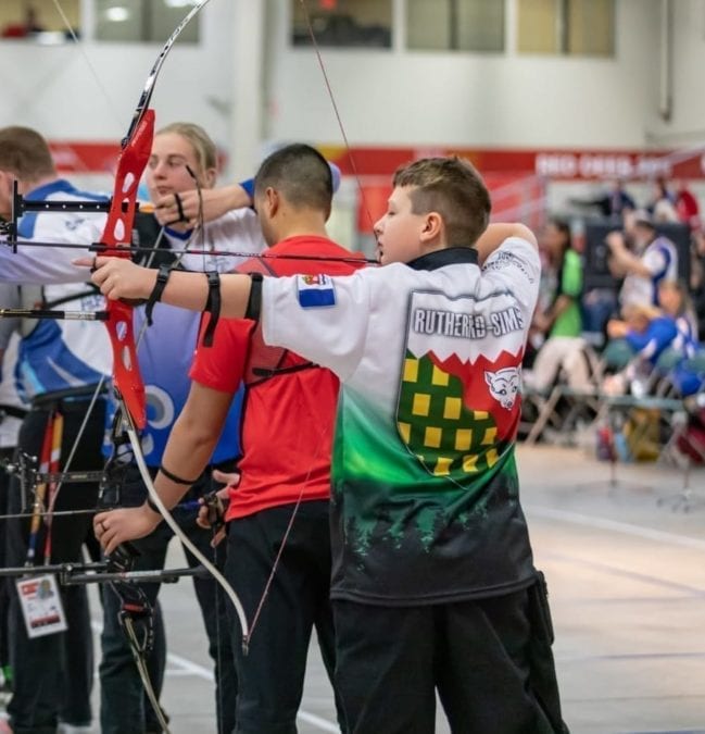 Ferghus Rutherford-Simon of Fort Smith takes aim at the target during action in the male recurve event in archery at the Canada Winter Games in Red Deer, Alta., on Tuesday. Peter Fuzessery/Canada Winter Games photo