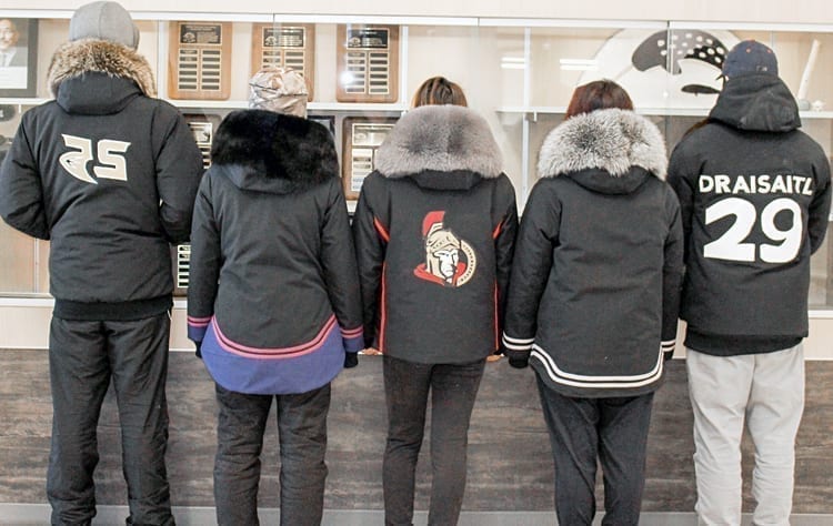 Grade 10 students, from left, Macleod Arnatsiaq, Sabina Iyyiraq, Angelina Siusangnark, Melanie Kaunak and Darryl Angotingoar model the backview of their completed parkas during a special jappa-making program at Tuugaalik High School in Naujaat on Feb. 22, 2019. Photo courtesy Julia MacPherson