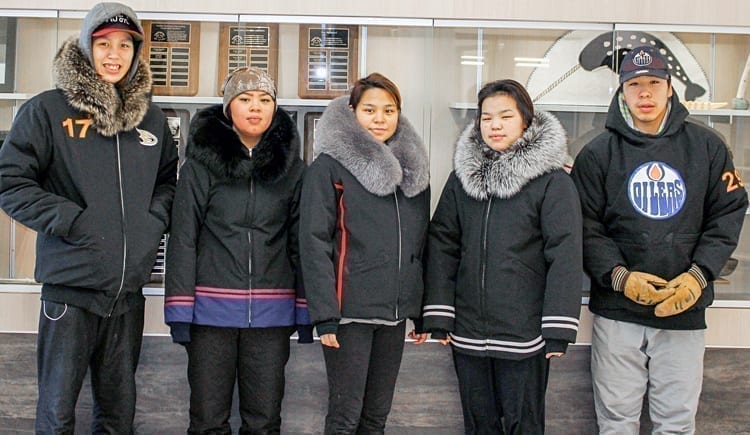 Grade 10 students, from left, Macleod Arnatsiaq, Sabina Iyyiraq, Angelina Siusangnark, Melanie Kaunak and Darryl Angotingoar display their completed jackets during a special jappa-making program at Tuugaalik High School in Naujaat on Feb. 22, 2019. Photo courtesy Julia MacPherson