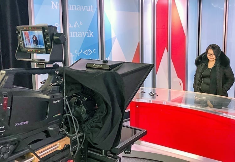 Arviat Film Society member Elena Akammak gets to try on the CBC's TV studio for size while in Iqaluit to attend the Nunavut film conference on March 12-13, 2019. Photo courtesy Eric Anoee