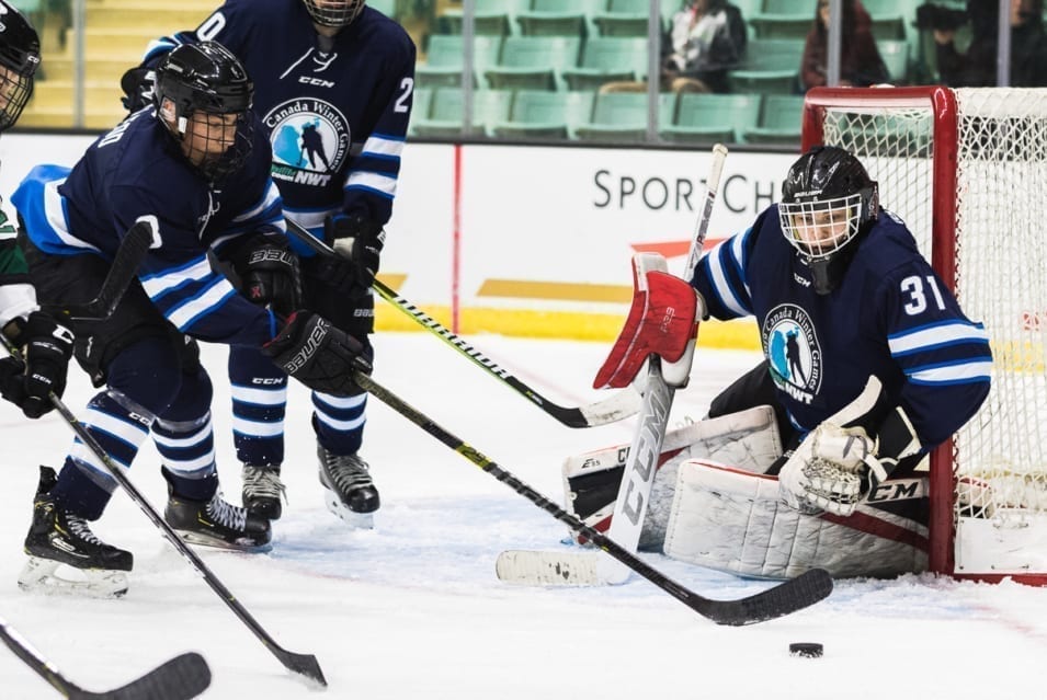 Carter McLeod reaches for the puck in front of goaltender Liam Tereposky during action at the Canada Winter Games in Red Deer, Alta., this past February. McLeod returned to Red Deer to play in the Alberta Cup bantam hockey tournament last week. Brandon White/Canada Winter Games photo
