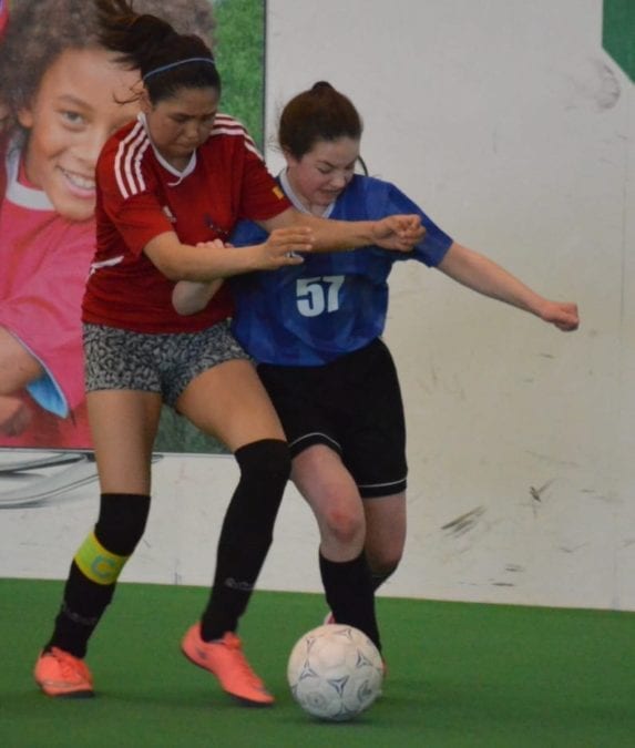 Sophia Barichello of William McDonald, right, does battle with Rankin Inlet's Erin Kaludjak for possession during the Grade 8 girls final of Junior Super Soccer at the Fieldhouse on Sunday. James McCarthy/窪蹋勛圖厙 photo