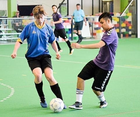 Markus Cluff of Sir John Franklin manages to keep the ball away from a Hay River attacker during Senior Super Soccer U19 boys playoff action at the Fieldhouse on Sunday. James McCarthy/窪蹋勛圖厙 photo