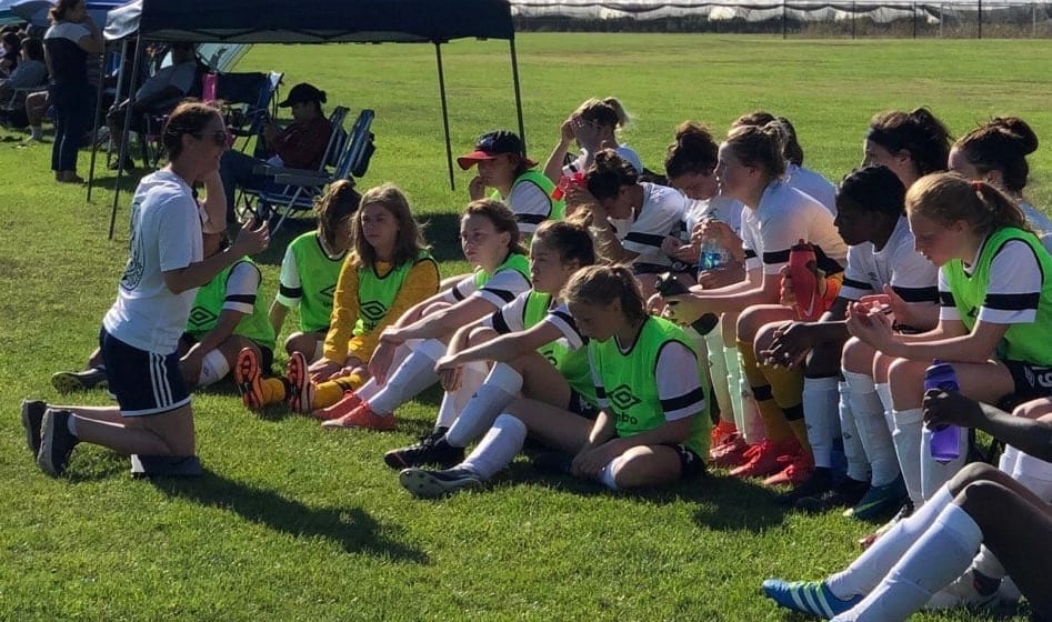 Gina Michel, left, head coach of the Western Canada Summer Games girls soccer team, talks with her players during a break in the action in Ventura, California on Wednesday. The girls and boys teams are in California for a training camp, which wraps up on Monday. photo courtesy of Don Stewart