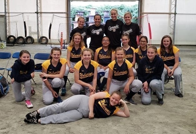 The Yellowknife Wolverines U14 girls team are all smiles after getting the chance to practice with members of the Canadian national women's softball team in Surrey, B.C., earlier this month. They are, in front, Raine Mingo; second row from left, Mackenzie Chiasson, Giselle Penney, Ellie Loutit, Ella Skauge and Keira Coakwell; third row from left, Kali Skauge, Amber Lennie-Ipana, Ellie Lucas, Adrianna Hendrick and Brooklyn Helyar; back row from left, Joey Lye, Jennifer Salling, Jennifer Gilbert and Victoria Hayward, all from the Canadian national team. photo courtesy of Heather Coakwell
