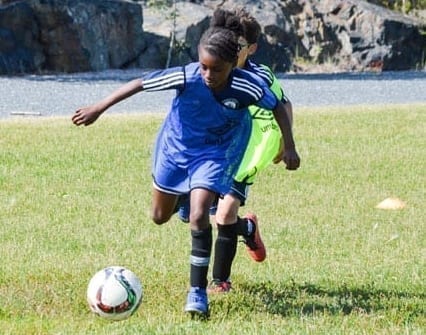 Ayanna Darku dribbles the ball upfield during a mini-game as part of the Whitecaps FC Academy camp at William McDonald Field on Sunday. James McCarthy/窪蹋勛圖厙 photo