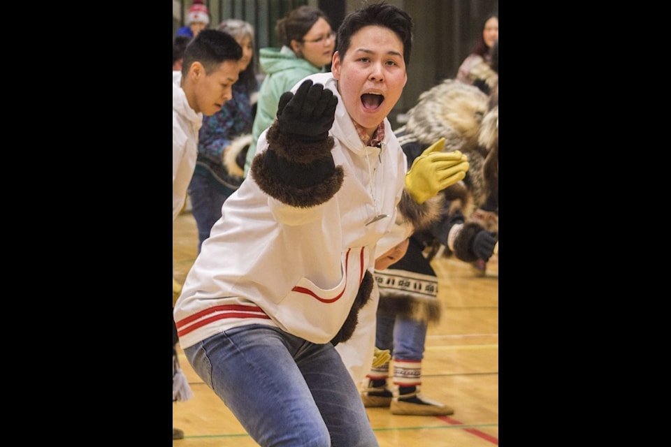 Larsen Nasogaluak shouts and holds a pose during a drum dance. Drum dancers will be on hand to to cap off the evening festivities at the Inuvik Sunrise Festival opening ceremonies on Jan. 10.