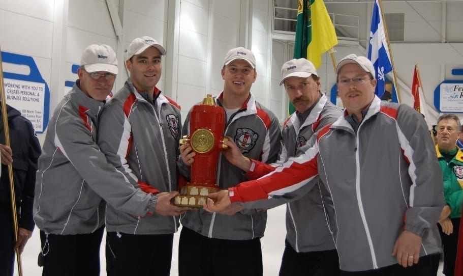 Team NWT hoisted the Hydrant, the championship trophy given to the winners of the Canadian Firefighters Curling Championship, in 2008 after running the table and going undefeated on their way to victory. They are, from left, lead Ingo Bauer, second Kevin Whitehead, third Chris Haichert, skip Steve Moss and team director Wyatt Scheller. photo courtesy of Canadian Firefighters Curling Association