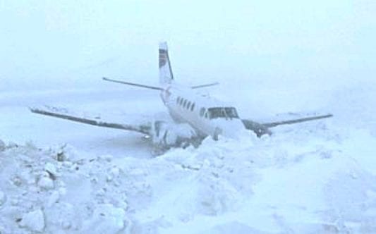 This King Air plane flying for Buffalo Airways slid off the runway and into a snowbank in Kugaaruk on Tuesday. photo courtesy of Barnaby Immingark