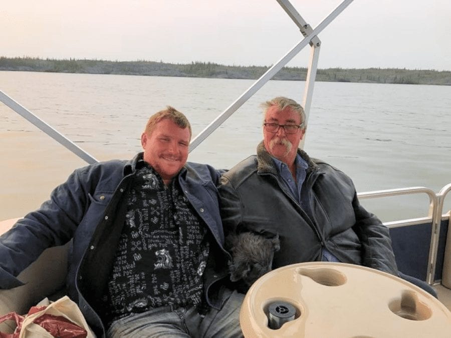 Les Rocher and eldest biological son Lindsey Rocher durng a fishing trip last summer. He died April 23 at age 63.