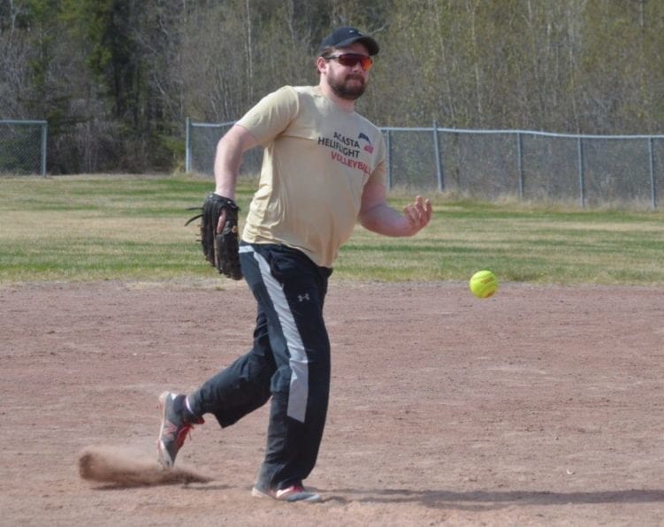 Garrett Hinchey warms up his pitching arm during a team practice at Parker Park on Sunday. Hinchey is also president of the Yk Fastball League and their season gets underway on June 15. James McCarthy/NNSL photo