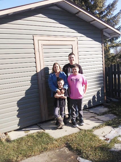 Lisa Thurber alongside her children Tristan, Kaleb and Kole. Thurber says she feels abandoned by the NWT Business Investment and Development Corporation after her bank foreclosed on her gas station and motel last year. photo courtesy of Lisa Thurber