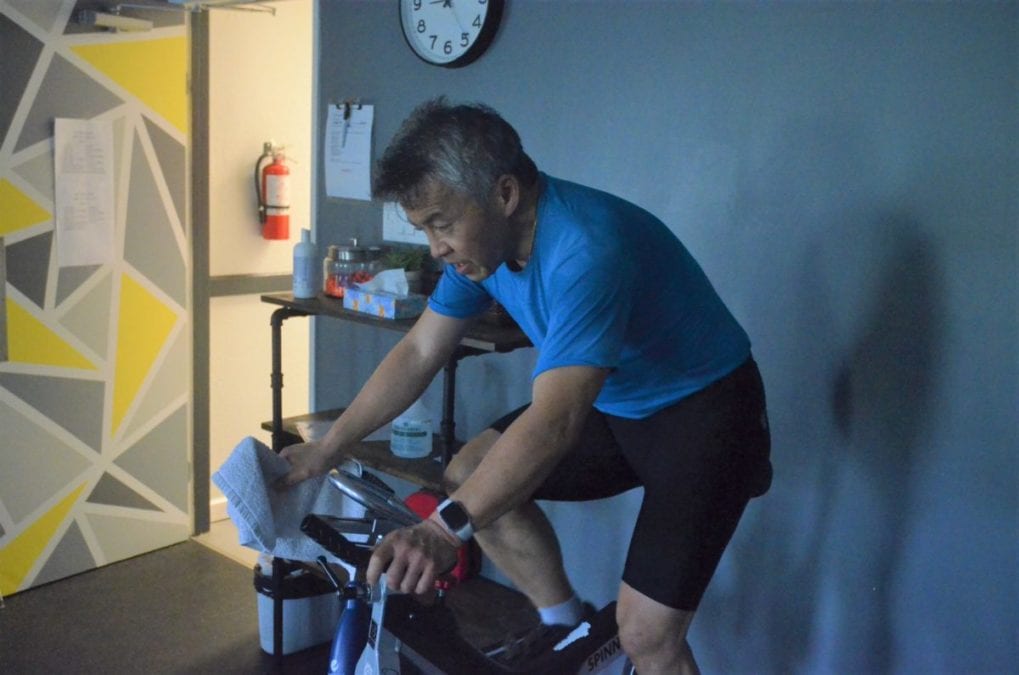 Ken Eng bears down on his bike during the Racquet Club's annual Spin-a-Thon, in support of the Stanton Territorial Hospital Foundation, on Saturday. James McCarthy/NNSL photo 