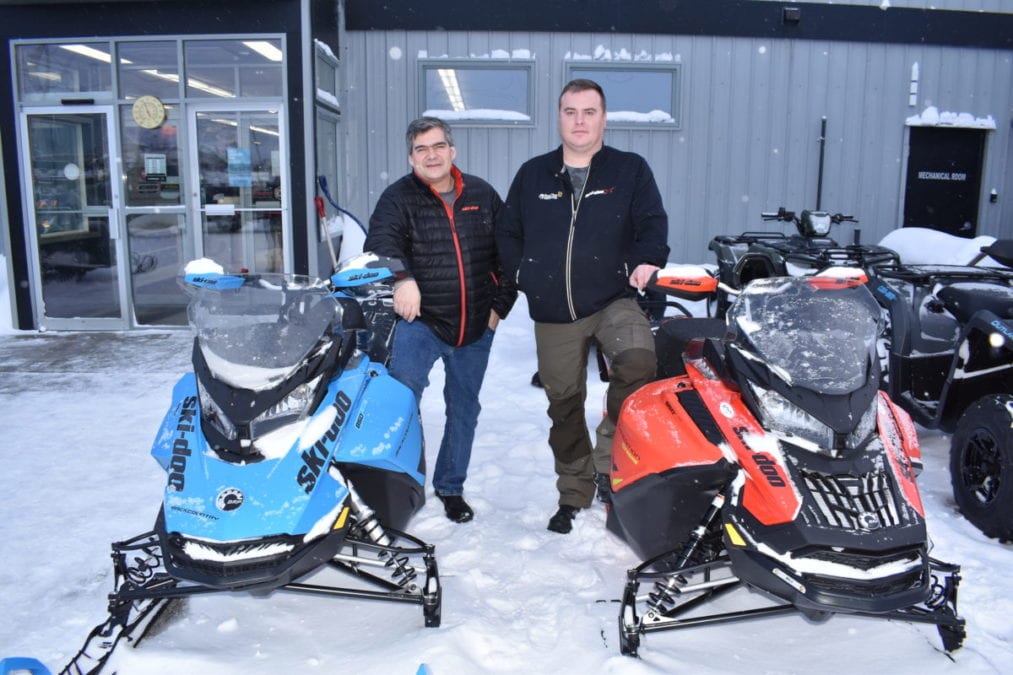 Mike Bryant, left, project manager at Polar Tech and company owner Joey Sutton, have sold about half of the 200 snow machines the company ordered for 2020. Blair McBride/NNSL photo