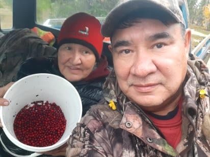 Cathy Marlowe, left, and James Marlowe rest after picking berries near Lutsel K'e. James Marlowe photo