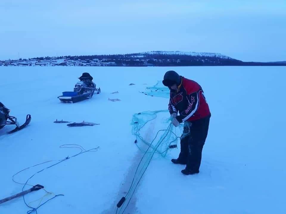 Sonny Marlowe checks a fishnet on in the winter. James Marlowe photo