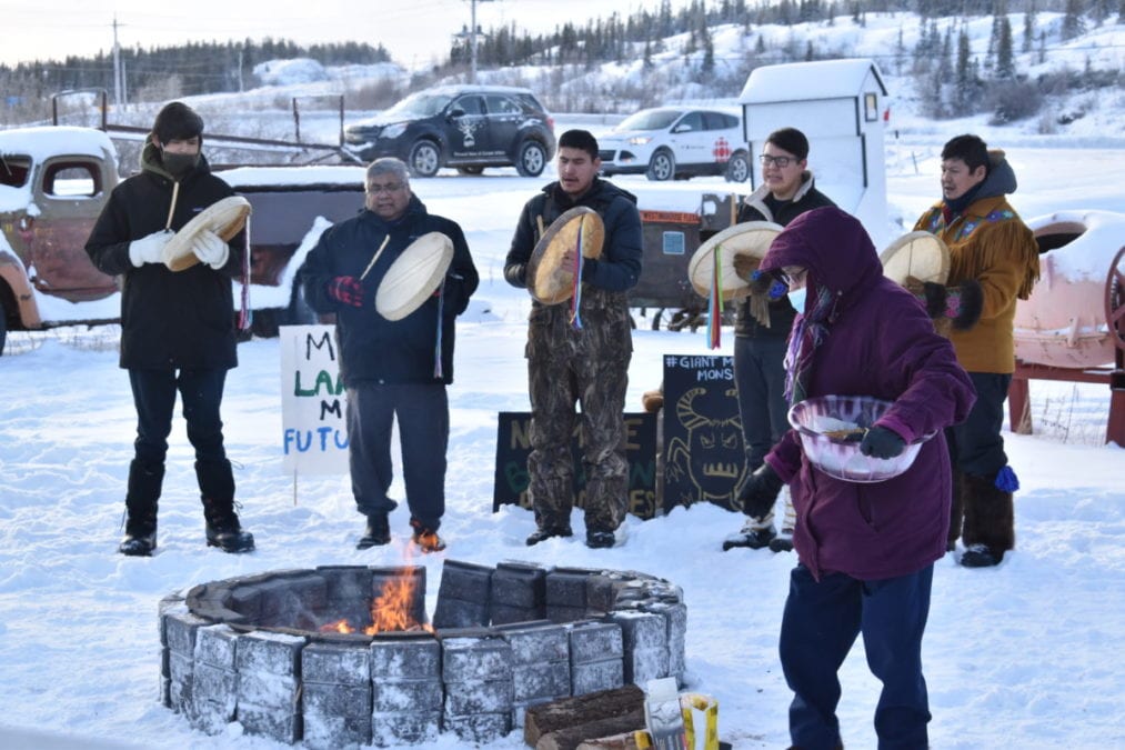 DJ Drygeese, left; Edward Sangris, Dettah chief of the Yellowknives Dene First Nation; Randy Baillargeon, Cody Drygeese and Bobby Drygeese perform a prayer ceremony as Verna Crapeau (front) feeds the fire with tobacco. Blair McBride/NNSL photo