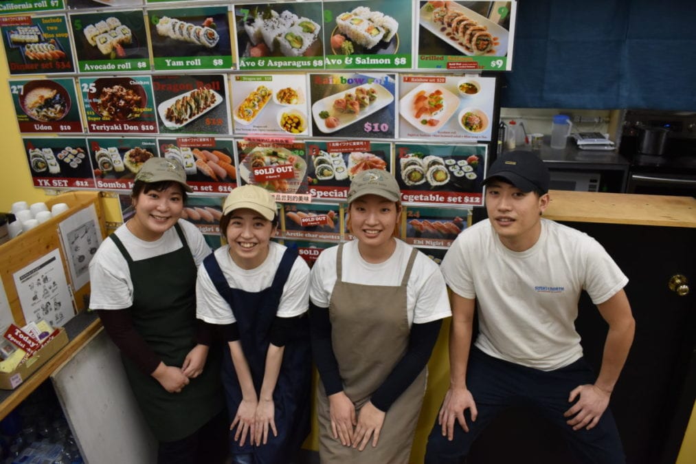 Mizuki Taira, left, Yuriko Ikeda, Momoko Ochiai and Kazuki Takekawa take a break amid the evening dinner period at Sushi North. Blair McBride/NNSL photo