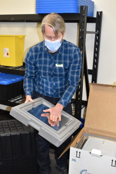 The vaccines are carried in 13-kg freezer boxes that have heavy insulated panels to maintain low temperatures, said Sean Marshall. Blair McBride/NNSL photo