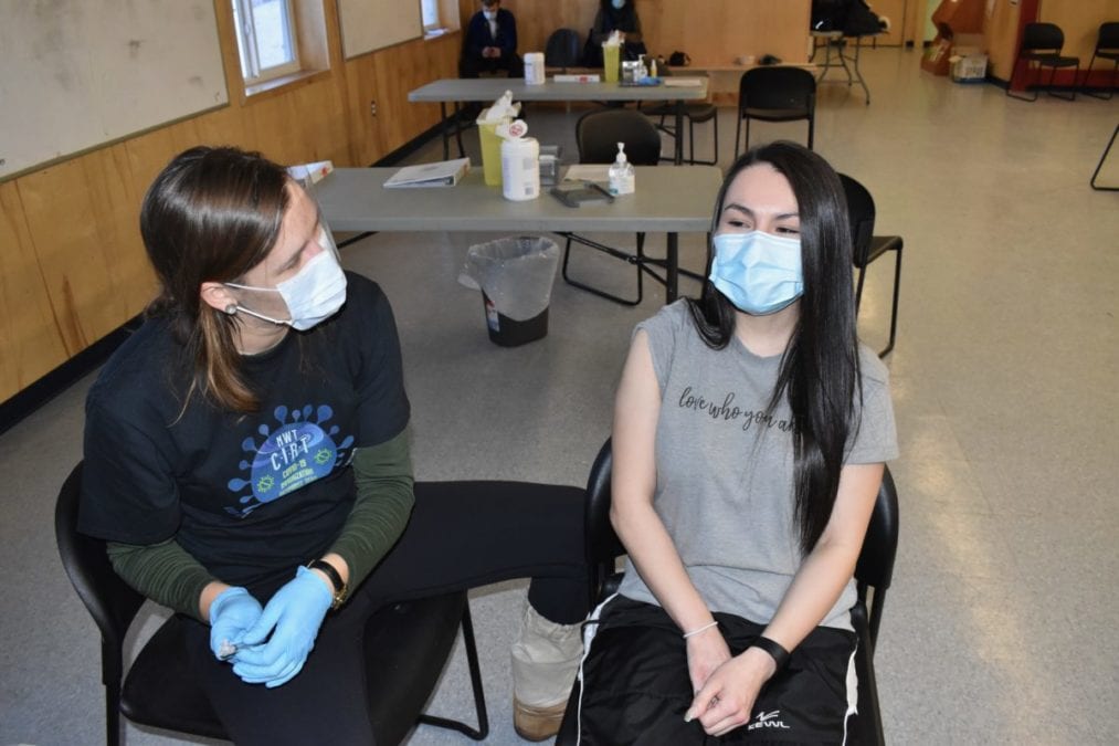Laura Bain, left, speaks with a relieved Danielle Judas just after she received her jab. Blair McBride/NNSL photo
