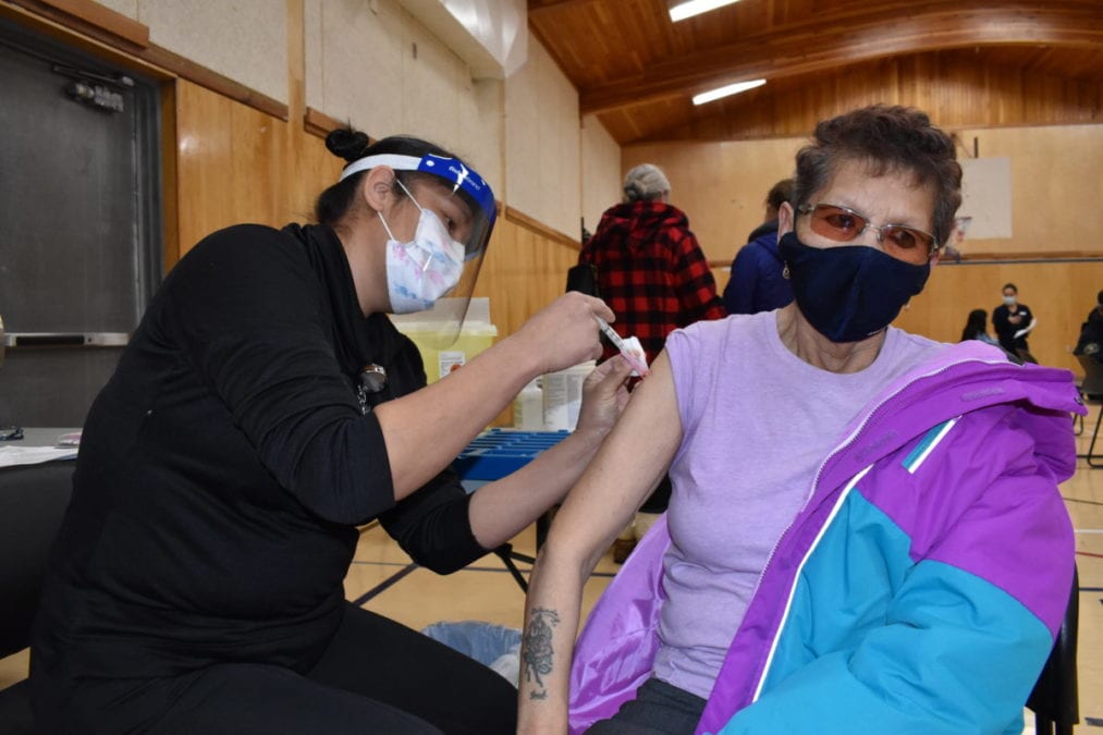 Erica Abel, left, administers the Moderna vaccine to Susan Carlson. "I think it’s worth taking. (Covid) is a disease you don’t fool around with. It’s probably a life saver," Carlson said. Blair McBride/NNSL photo