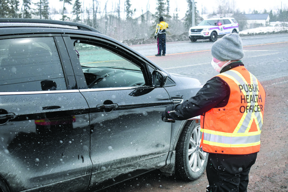 Public health officer Chloe LeTourneau speaks with a driver about Covid-19 and health regulations at the checkstop. NNSL photo